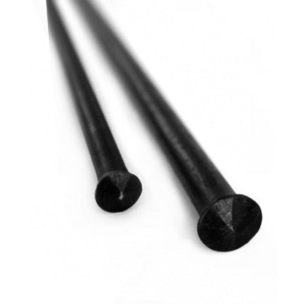 a pair of black scissors sitting on top of a table