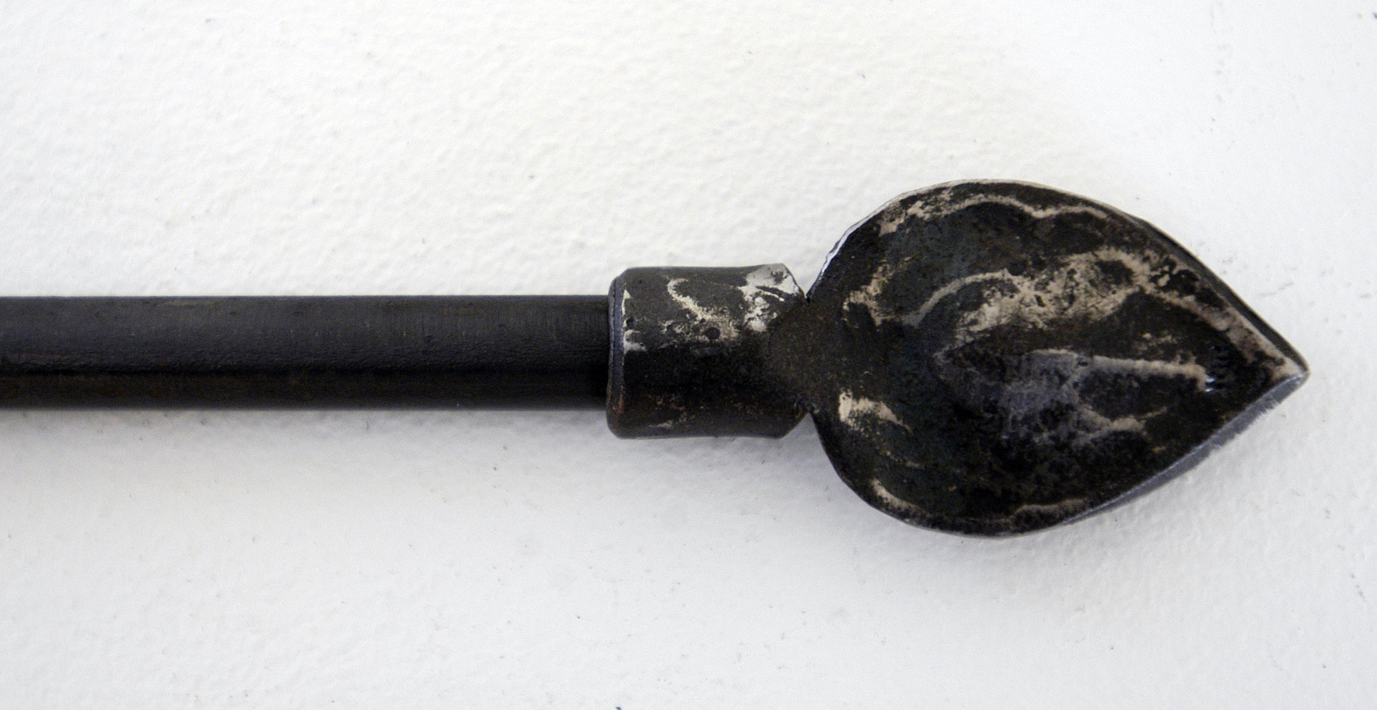 a pair of black scissors laying on a table