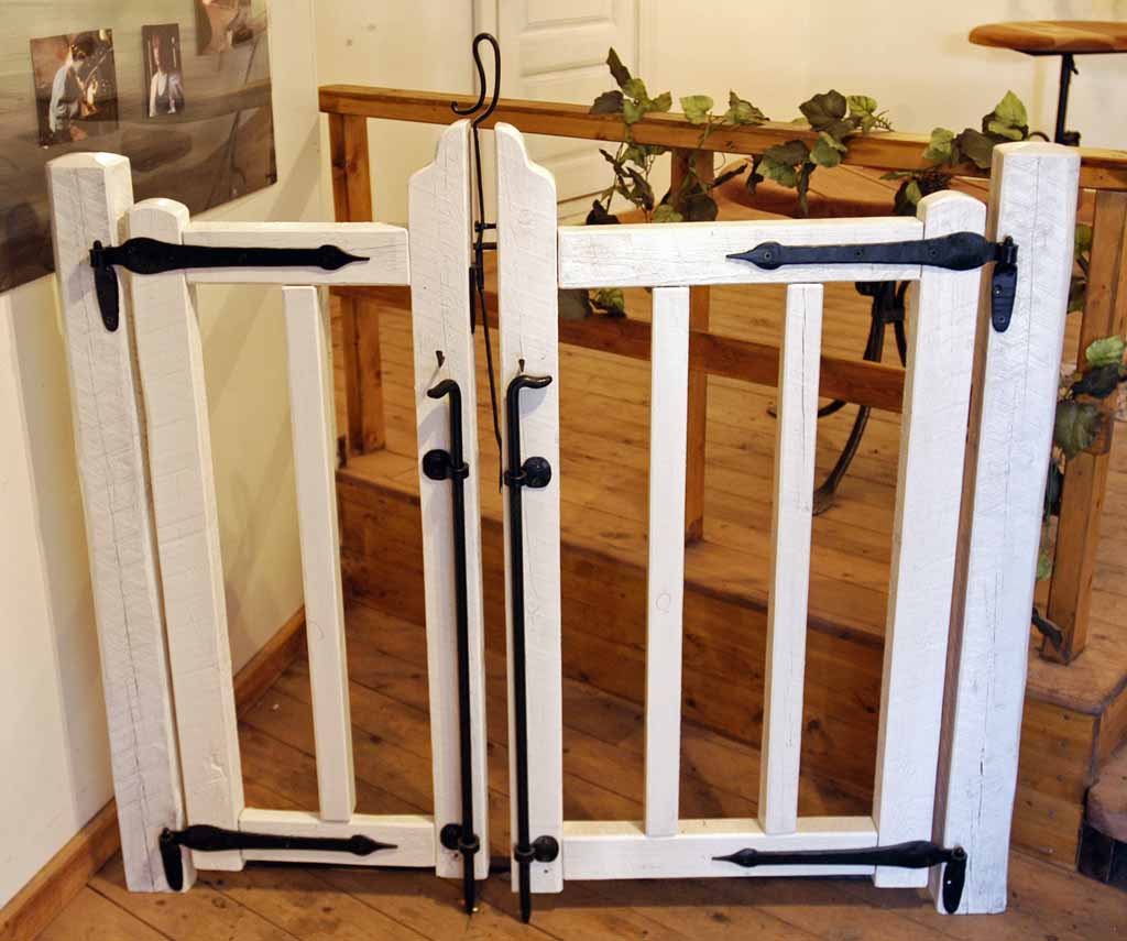 a group of baseball bats leaning against a wall