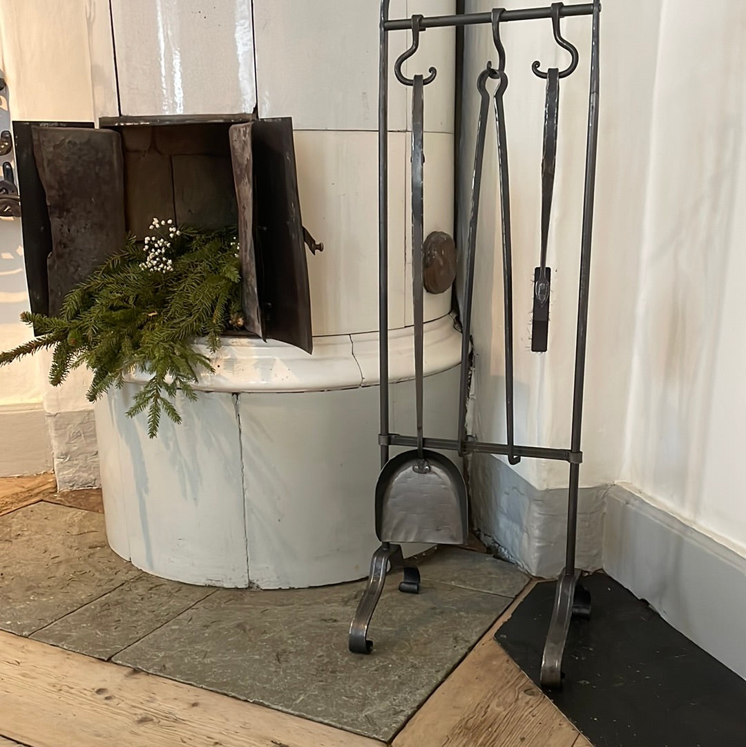 a white toilet sitting in a bathroom next to a plant 